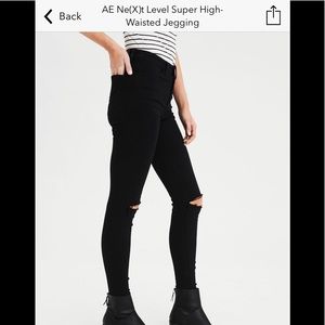 Black jeans with rips in knees